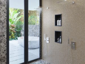 shower with gold tiles 