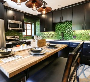 wood accented cabinetry with green tiles