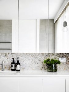 swirling marble backsplash tiles in modern kitchen