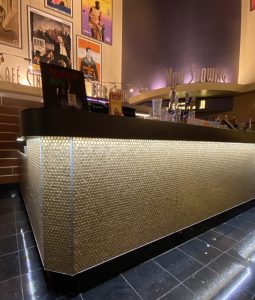 movie theater popcorn stand with gold tiles